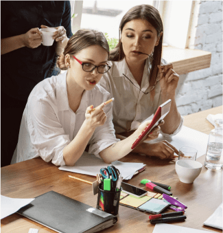 UX UI design team collaborating on website wireframes and user experience planning in a modern office